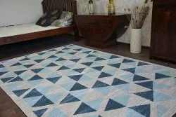 Elegancki dywan NORDIC CANVAS w szarym kolorze, wykonany z wysokiej jakości materiałów