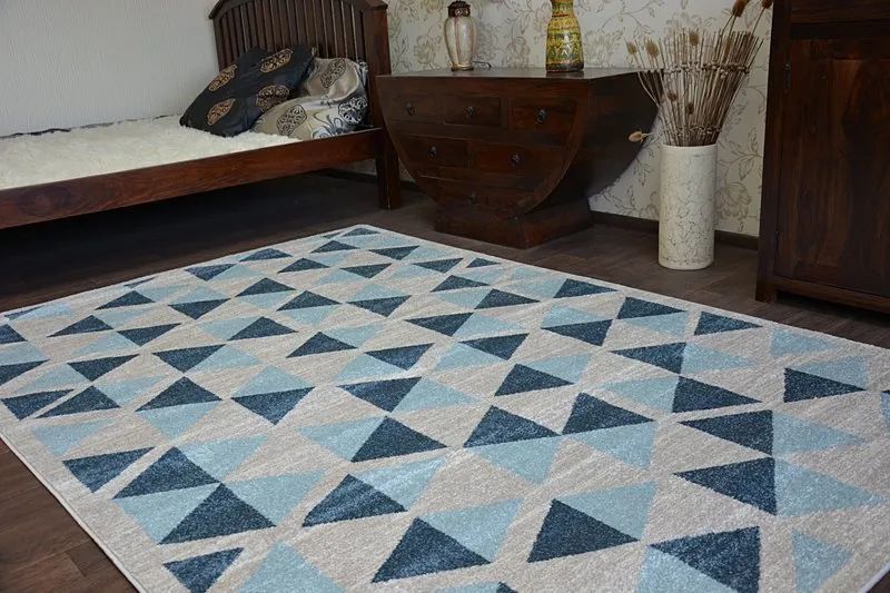 Elegancki dywan NORDIC CANVAS w szarym kolorze, wykonany z wysokiej jakości materiałów