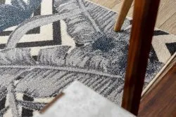 Nowoczesny dywan w kremowo-niebieskie liście, miękki i stylowy materiał