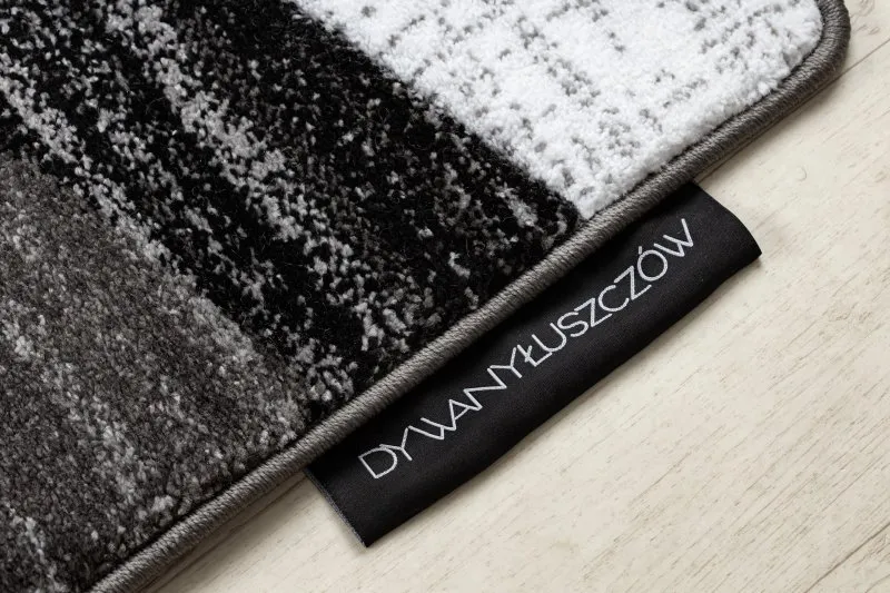 Stylowy dywan w szare pasy, idealny do nowoczesnych wnętrz