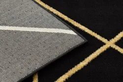 Luksusowy dywan EMERALD o gładkiej fakturze, geometryczny design w czerni i złocie