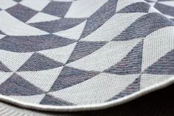 Stylowy dywan SION w geometryczne wzory, idealny do dekoracji pokoju dziecięcego lub ogrodu zimowego
