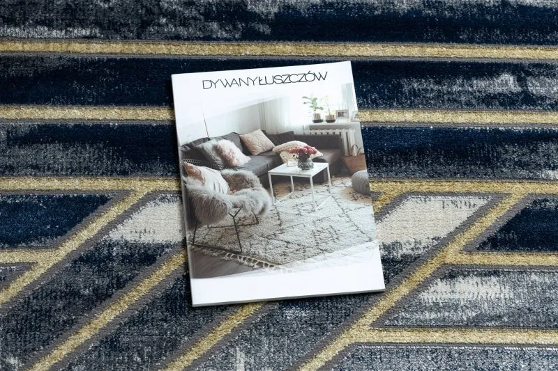 Stylowy dywan w odcieniach granatu i złota, idealny do nowoczesnych wnętrz