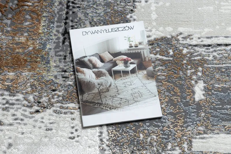 Kremowo-złoty dywan DE LUXE 633 Abstrakcja, styl nowoczesny