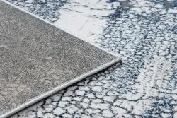 Strukturalny dywan DE LUXE 528 o miękkiej teksturze w kremie i granacie