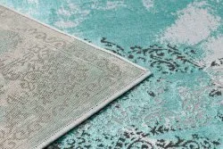 Strukturalny materiał dywanu DE LUXE 6754, elegancki zielono-szary design