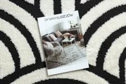 Nowoczesny dywan w odcieniach kremu i czerni, stylowy dodatek do wnętrz