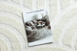 Kremowy dywan z muszelkami, stylowy dodatek do wnętrz