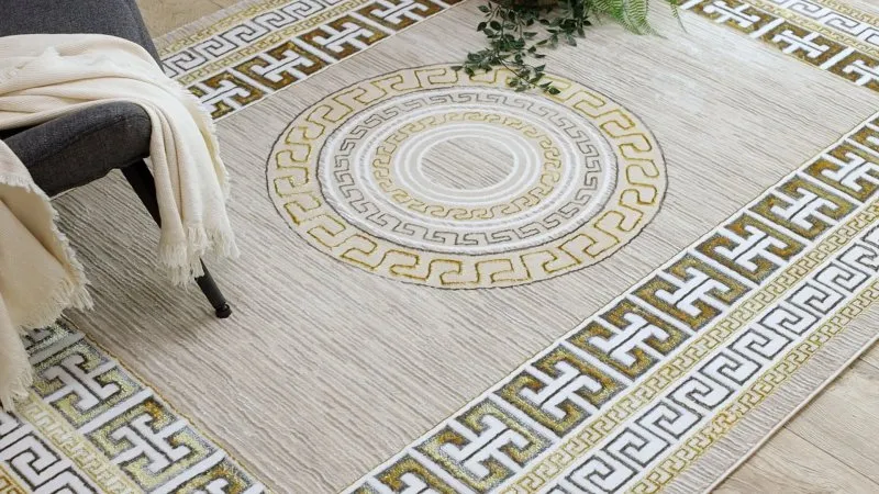 Stylowy dywan w odcieniach kremu i złota, nowoczesny design, idealny do wnętrz